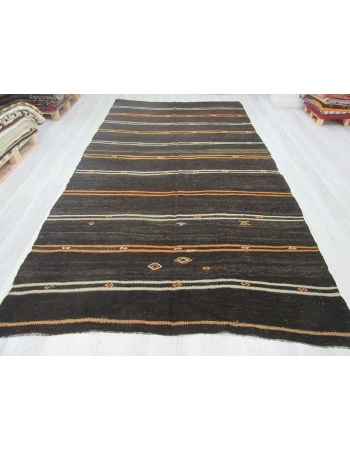 Yellow and white striped black Turkish kilim rug