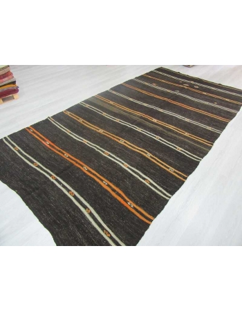 Yellow and white striped black Turkish kilim rug