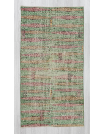 Distressed vintage green ground Turkish art deco rug