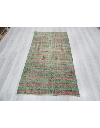 Distressed vintage green ground Turkish art deco rug