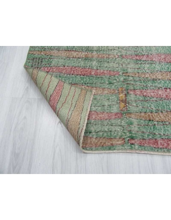 Distressed vintage green ground Turkish art deco rug