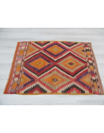 Vintage colorful small Turkish kilim rug