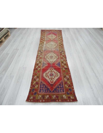 Vintage worn out Turkish runner rug