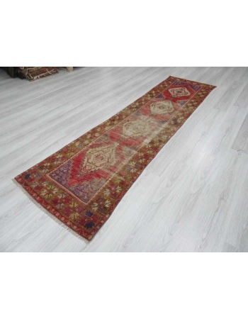 Vintage worn out Turkish runner rug