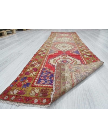 Vintage worn out Turkish runner rug