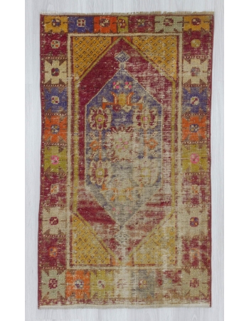 Vintage distressed colorful small Turkish rug