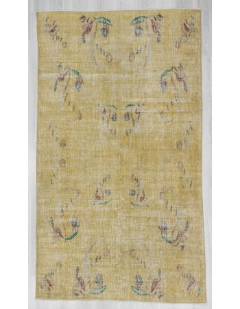 Distressed vintage yellow Turkish deco rug