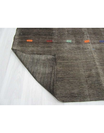 Handwoven vintage black kilim rug