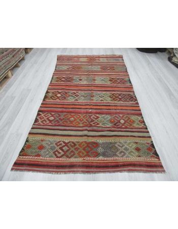 Vintage embroidered kilim rug