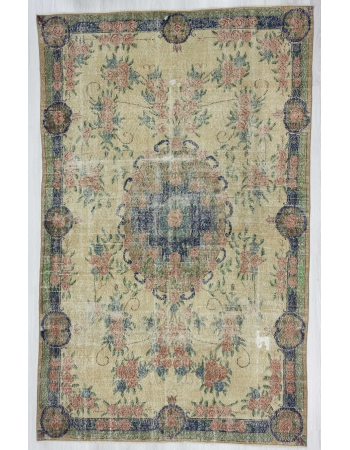 Distressed floral designed vintage Turkish rug