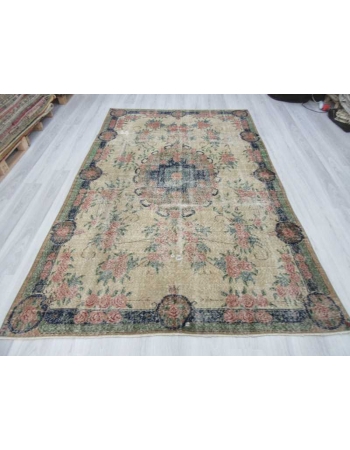 Distressed floral designed vintage Turkish rug