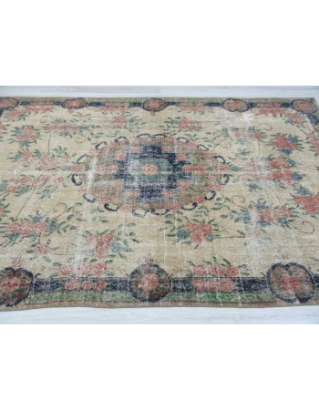 Distressed floral designed vintage Turkish rug