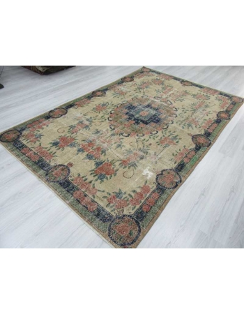 Distressed floral designed vintage Turkish rug