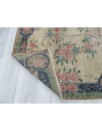 Distressed floral designed vintage Turkish rug