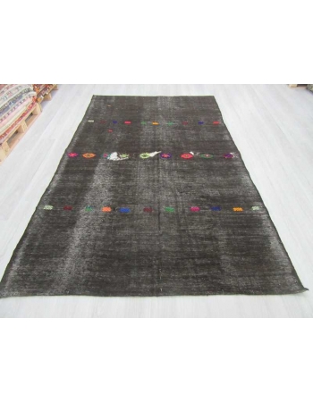 Embroidered vintage black kilim rug