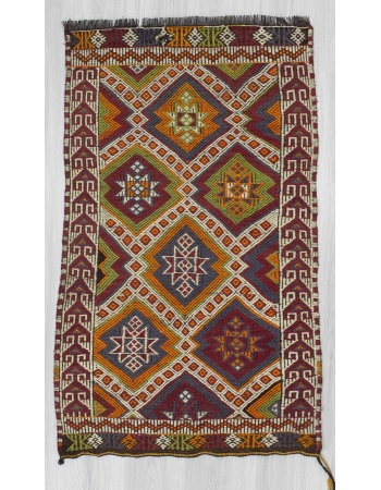 Small Vintage embroidered kilim rug