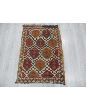 Vintage small embroidered kilim rug