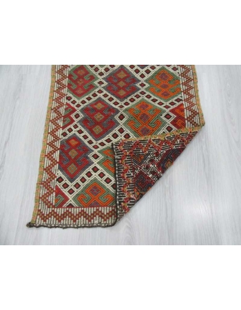 Vintage small embroidered kilim rug