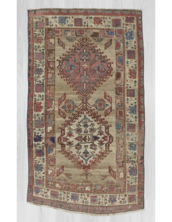 Antique distressed small Persian rug