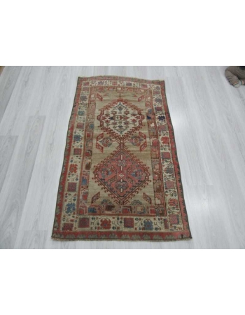 Antique distressed small Persian rug