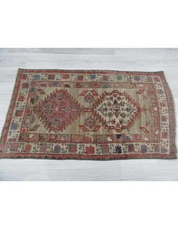 Antique distressed small Persian rug