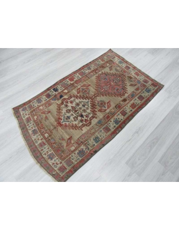 Antique distressed small Persian rug