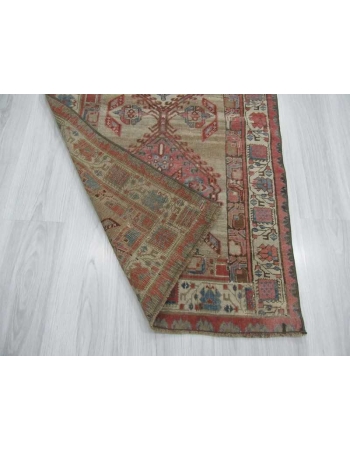 Antique distressed small Persian rug